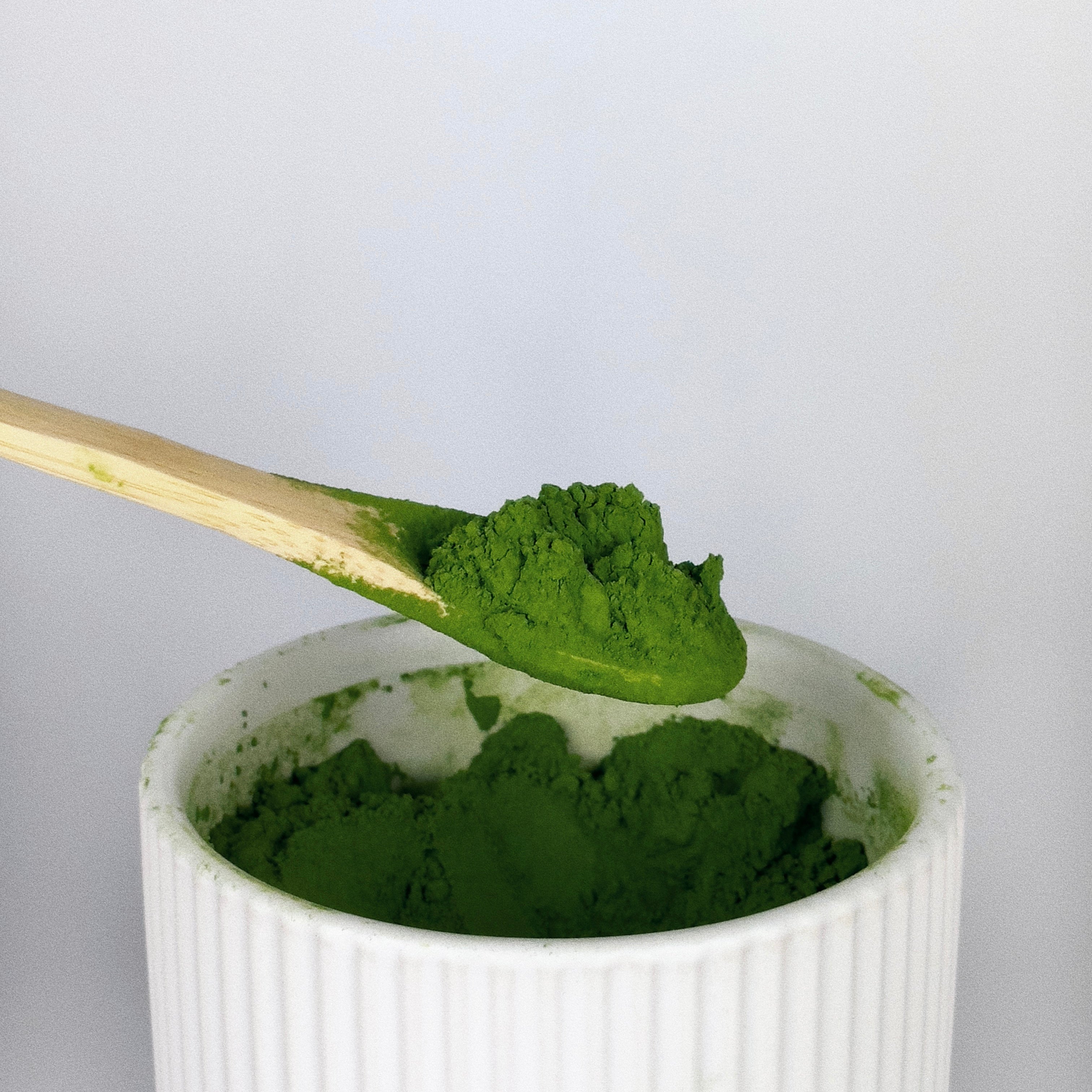 Bamboo Spoon scooping Matcha for Matcha Latte