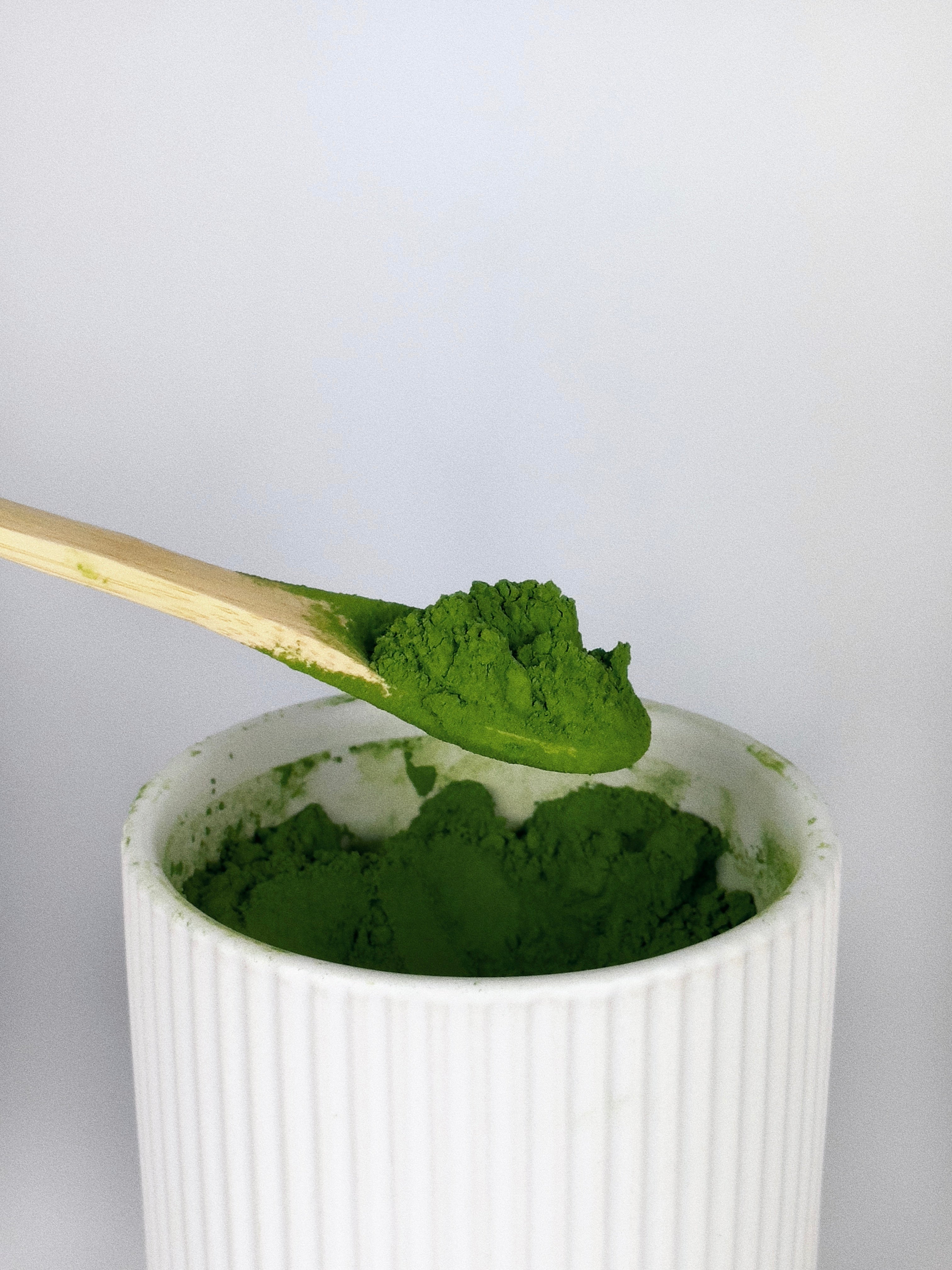 Bamboo Spoon scooping Matcha for Matcha Latte