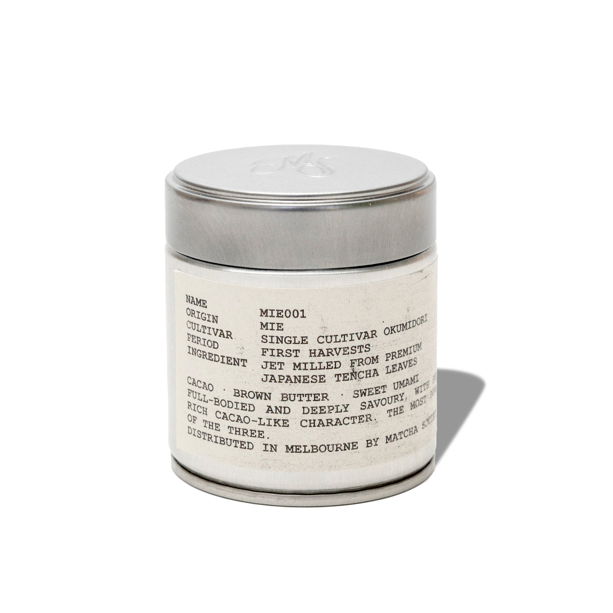 Matcha Society's MIE001 Okumidori matcha powder in a silver tin on a white background