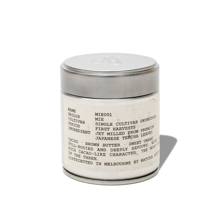 Matcha Society's MIE001 Okumidori matcha powder in a silver tin on a white background